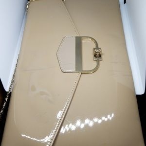 Tan clutch with gold strap